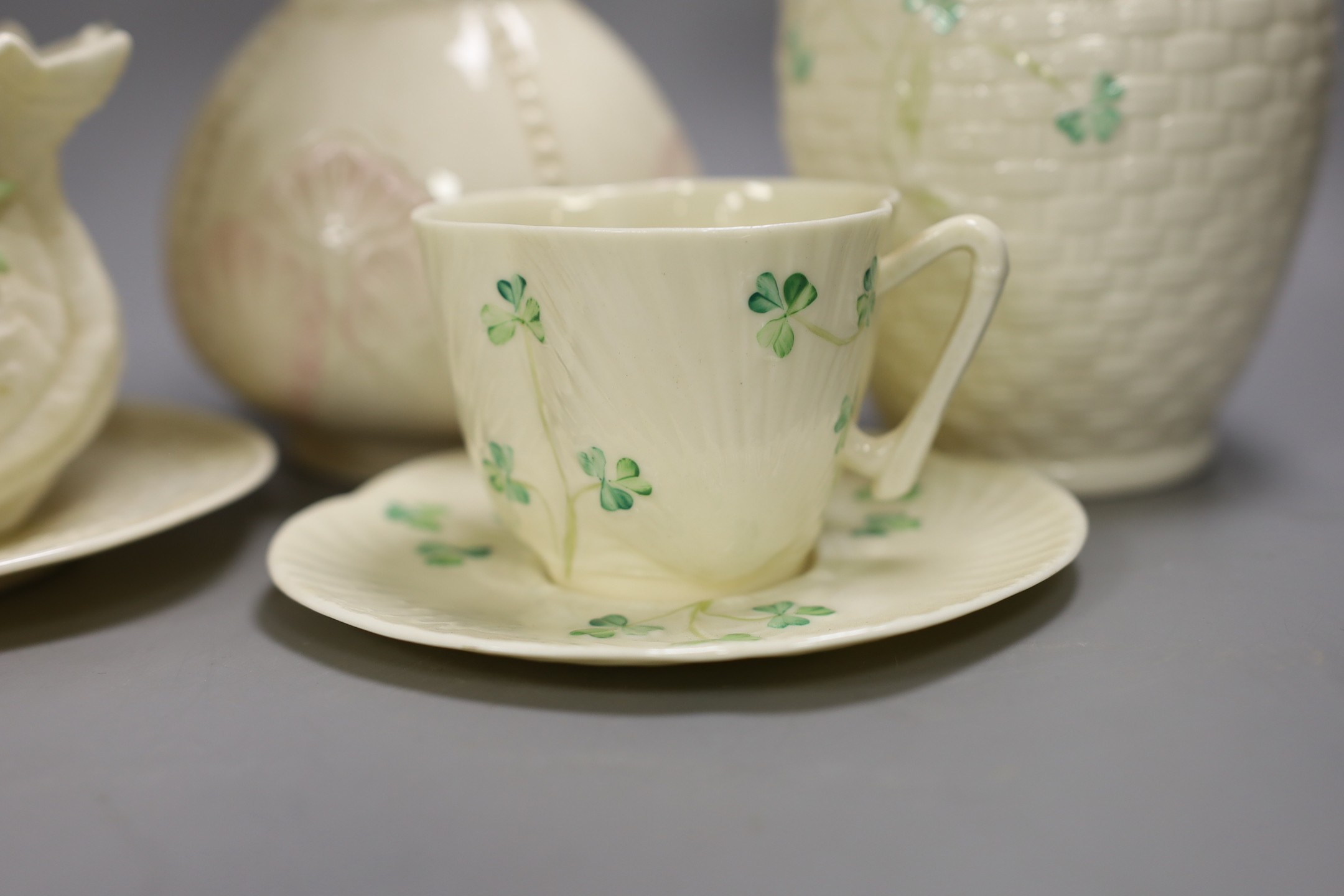 A small collection of Belleek porcelain (9, including saucers)